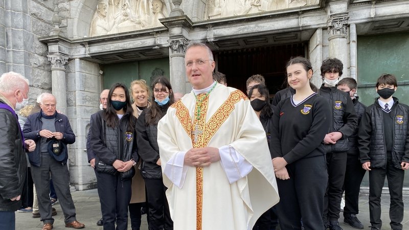 Bishop Michael Duignan and schoolchildren